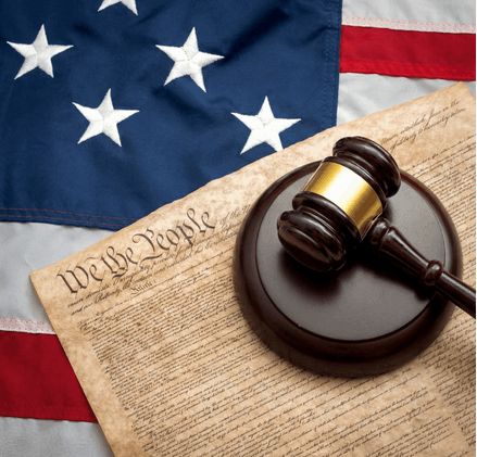 Gavel on We the People document with American flag